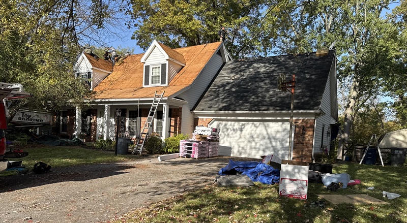 workers doing a roof replacement in toledo
