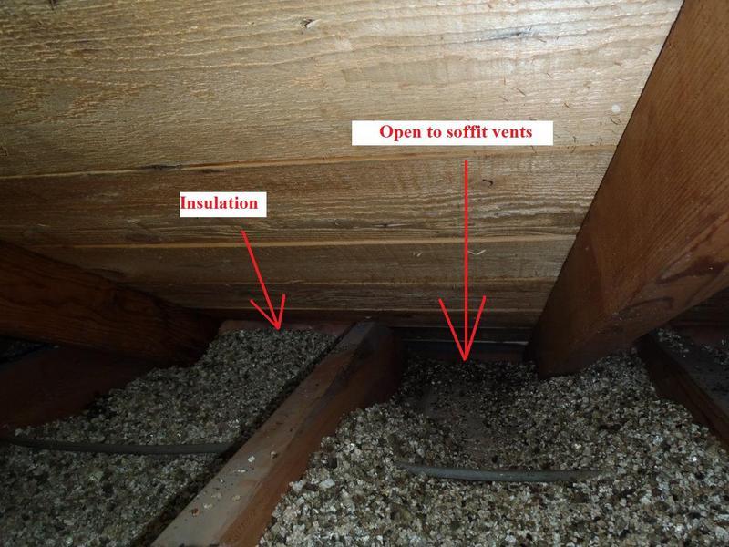 Attic insulation near soffit vents showing open intake airflow at the eaves