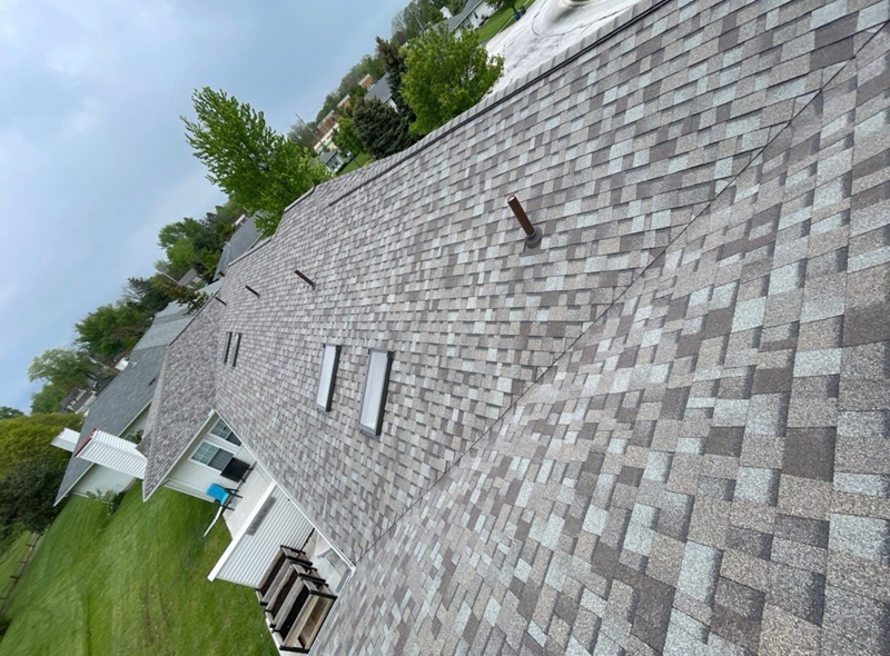 Gray asphalt shingle roof showing factors that affect roof replacement cost in Toledo